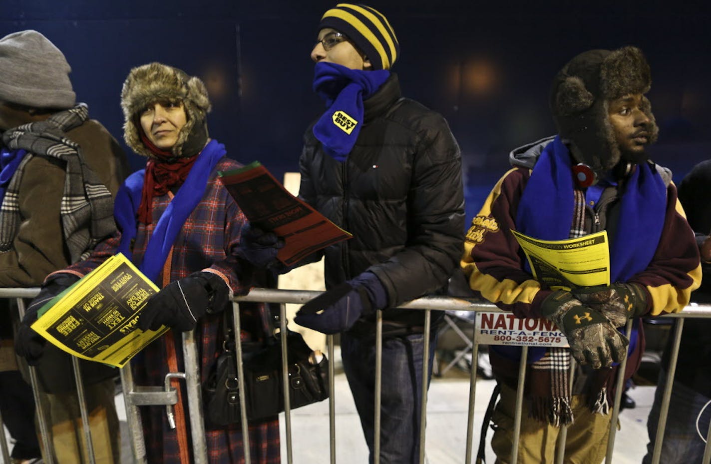 Some people had been in line in the cold weather since 9 a.m. like Soha Attia (left) and her son Sharif (center) who stood in line before the doors opened for Black Friday shopping at 6 p.m. at Best Buy on Thursday, November 28, 2013 in Roseville, Minn. ] RENEE JONES SCHNEIDER &#x2022; reneejones@startribune.com