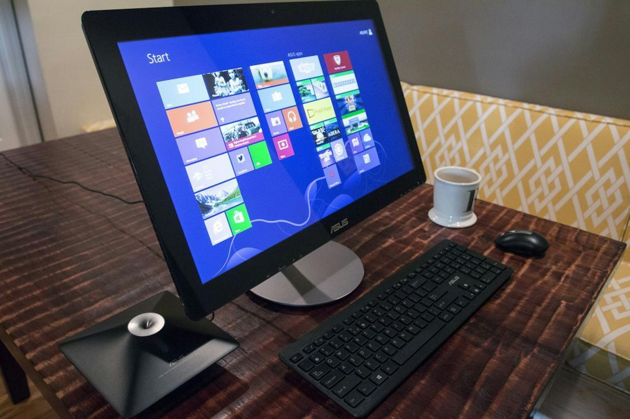 This April 24, 2014 photo shows the ASUS All-in-One PC ET2322 desktop computer, in Decatur, Ga. The computer has a touch-sensitive, 23-inch display.