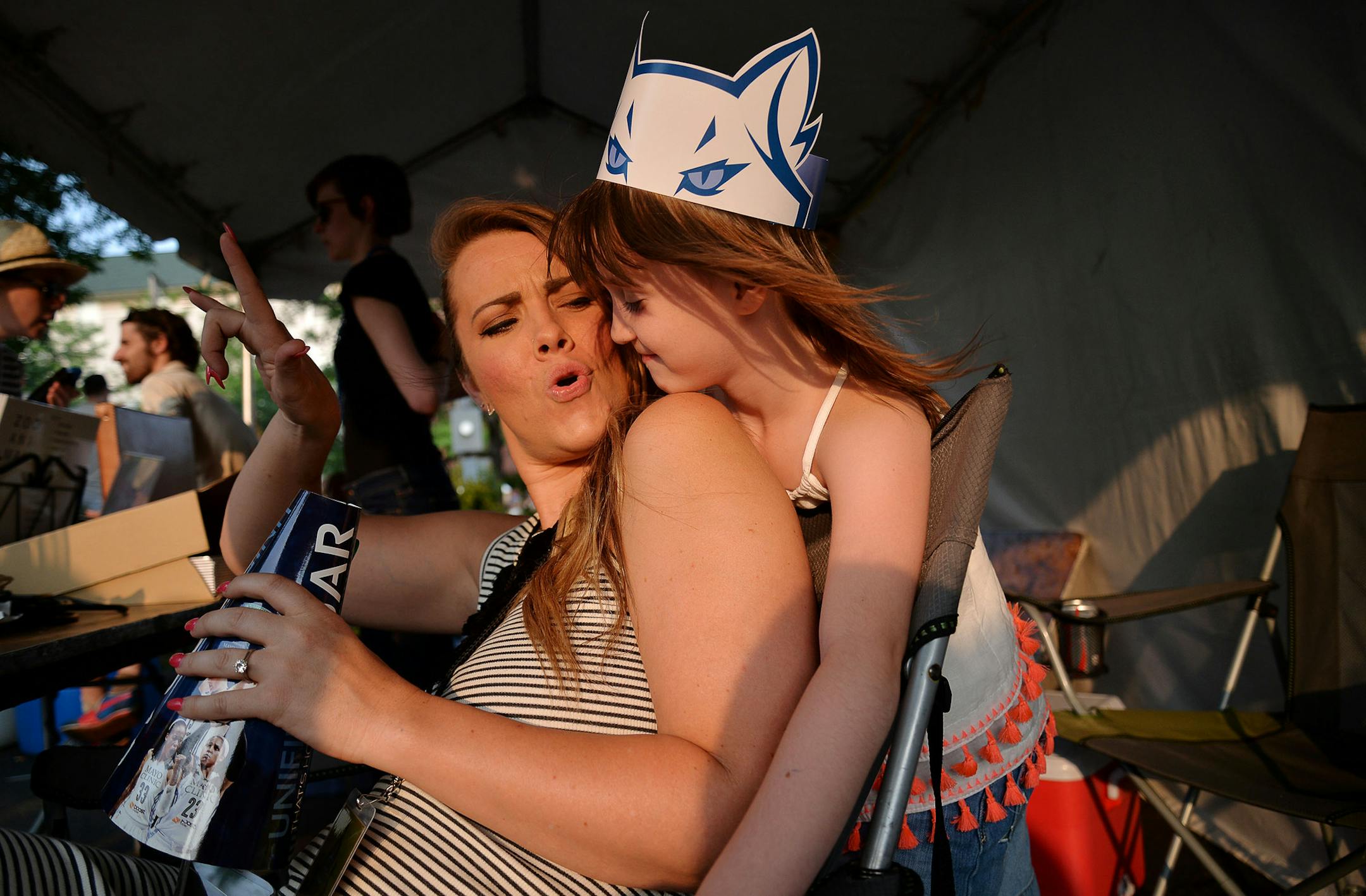From left, Laura Day cheered next to her soon-to-be step daughter, Christella Tays, 6, both of New Brighton, in Minneapolis, Minn., during The Basilica Block Party on Friday July 10, 2015. The Block Party features food vendors and performers such as Weezer and Wilco. The Block Party’s proceeds benefit the Basilica Landmark and The Basilica’s St. Vincent de Paul outreach program. ] RACHEL WOOLF · rachel.woolf@startribune.com