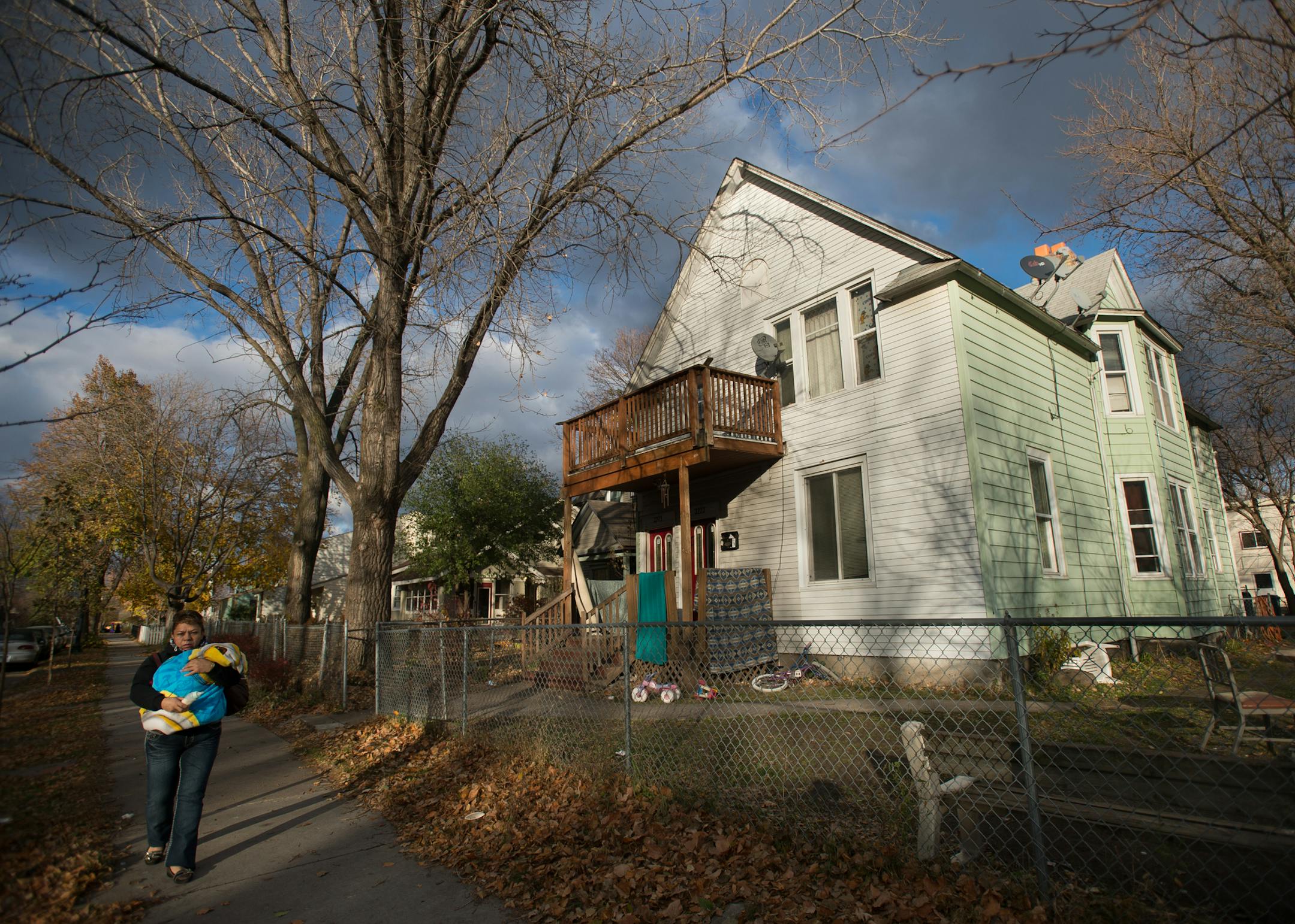 Librada Torres (cq) walks with her granddaughter past a rental property on 5th Avenue South that is on the city's list of its most problematic rentals. ] AARON LAVINSKY • aaron.lavinsky@startribune.com The city recently published a list of its most problematic rental properties. Minneapolis officials are taking a new, data-oriented approach to solving the city's problems with certain apartment buildings. New metrics create a most wanted list of sorts, highlighting the most problematic apa