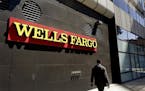Wells Fargo will sell its asset management business to two private equity firms for $2.1 billion.