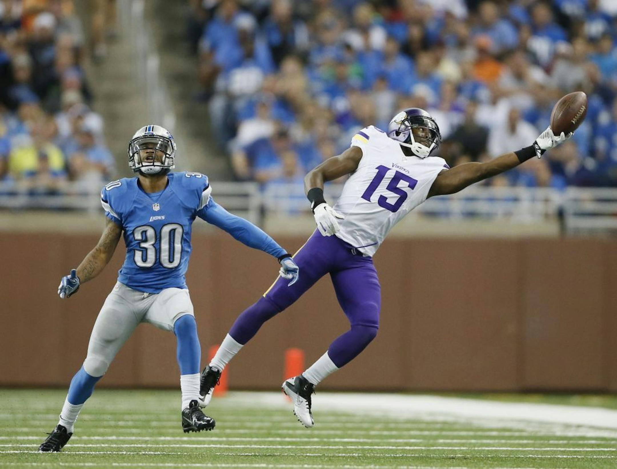 Greg Jennings (15) could not catch a pass that was thrown to far over Lions defensive back Darius Slay (30) during NFL action at Ford Field between the MInnesota Vikings and Detroit Lions Sunday September 8, 2013 in Detroit, MI. Detroit beat Minnesota 34-24.