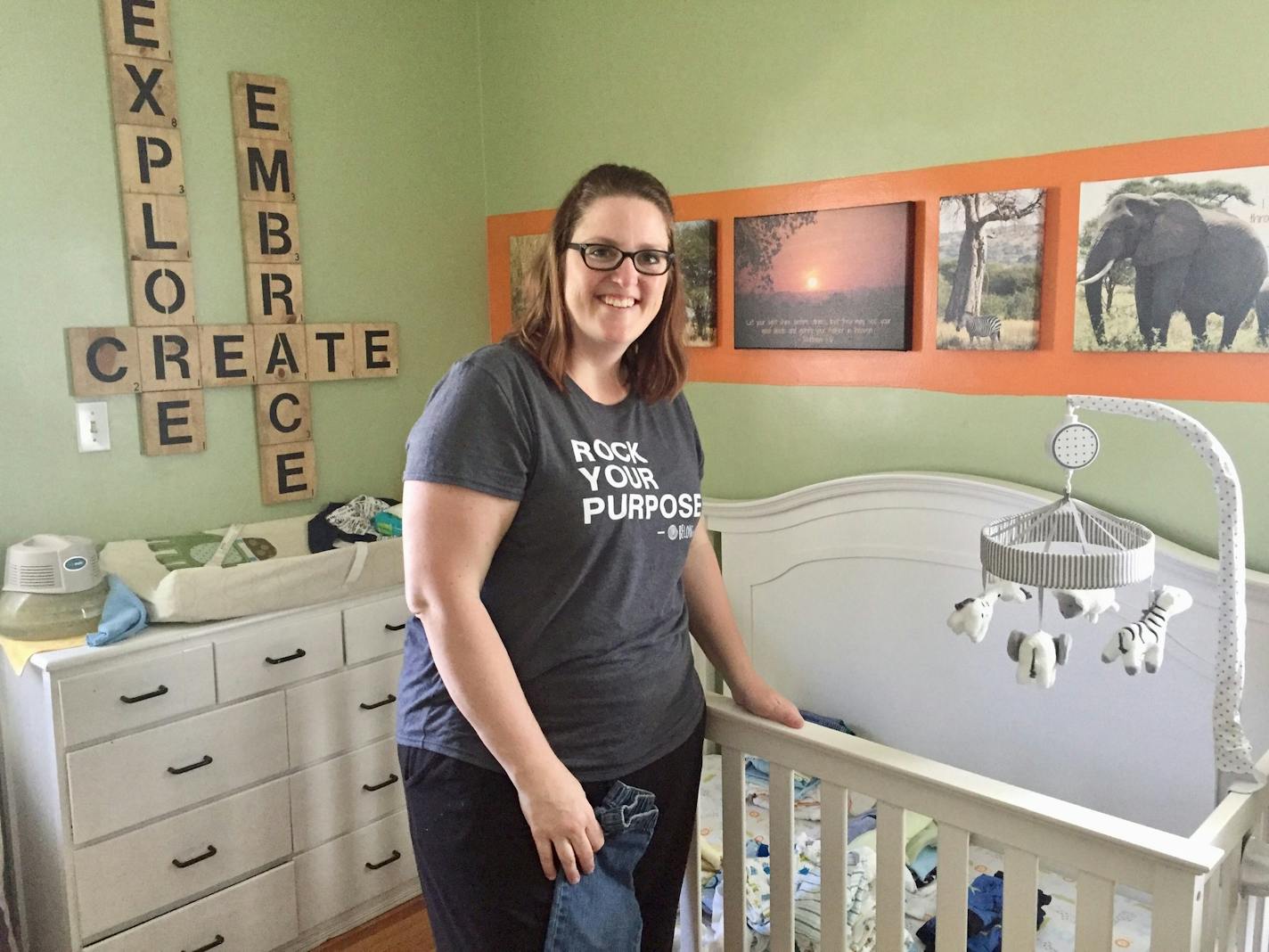 Jen Baumgarten, 38, of St. Louis Park poses in a nursery for the foster care children she's helping. She applied to be a Hennepin County foster care parent more than a year ago and welcomed a now 15-month-old boy last summer. Now, his brothers, two twin preemies, are joining Baumgarten at her St. Louis Park house.