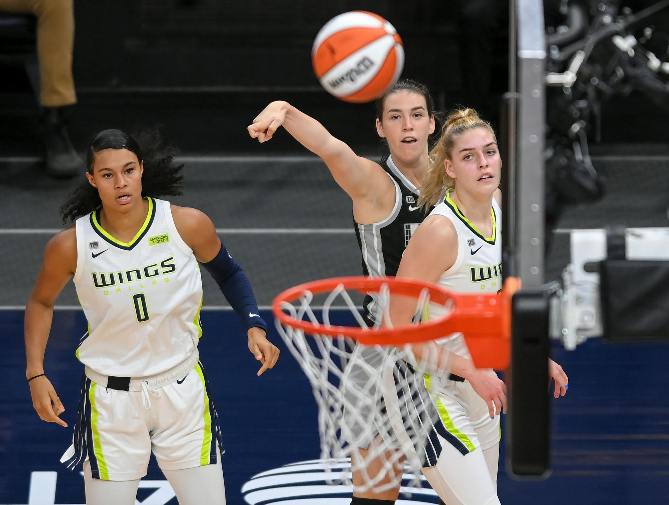 Dallas Wings forward Satou Sabally (0) and forward Bella Alarie (32) watched as Minnesota Lynx forward Bridget Carleton (6) scored a 3-point basket in the first half Wednesday.