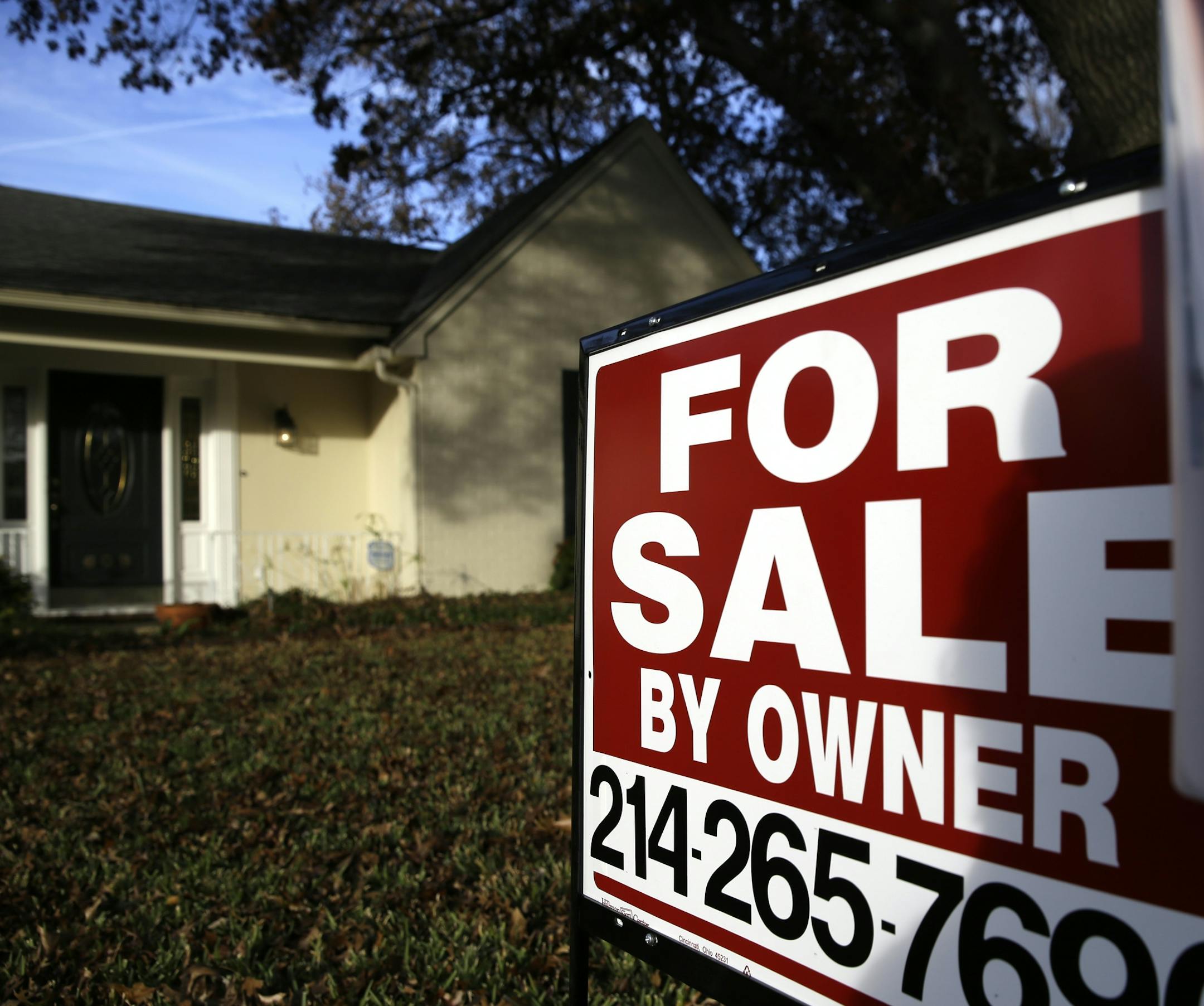 FILE - In this Dec. 16, 2014 file photo, a for sale by owner sign sits in front of a home in Richardson, Texas. Real estate data provider CoreLogic reports on November home prices on Tuesday, Jan. 6, 2015. (AP Photo/LM Otero, File) ORG XMIT: MIN2015010823474223