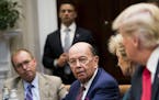 FILE-- Commerce Secretary Wilbur Ross speaks to President Donald Trump during the first meeting of the President's National Council for the American W