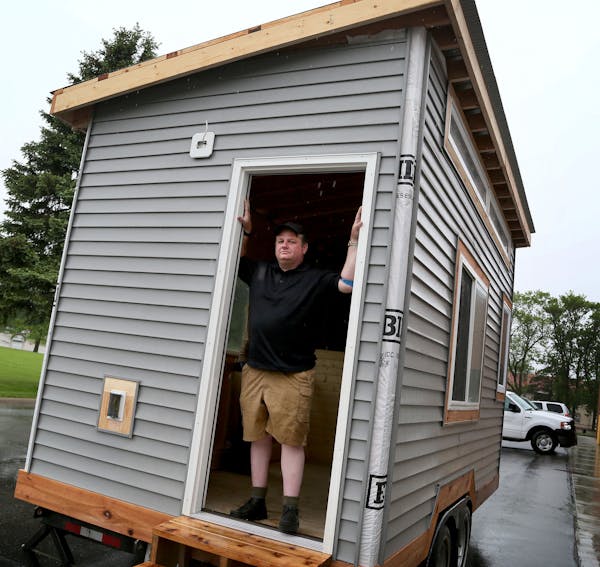 Brian Hurd has been homeless and living in a van for the past five years. Here, Hurd posed inside a tiny house under construction at Kandiyohi County 