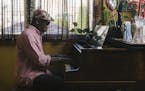 Orrin Evans plays piano at his home in Philadelphia. He joined the Bad Plus almost a year ago.