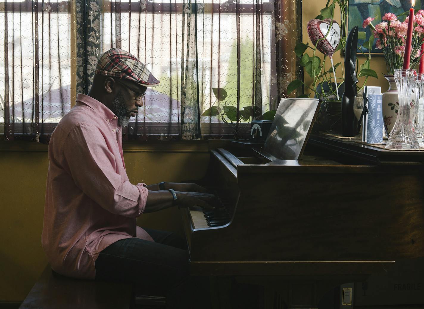 Orrin Evans plays piano at his home in Philadelphia. He joined the Bad Plus almost a year ago.