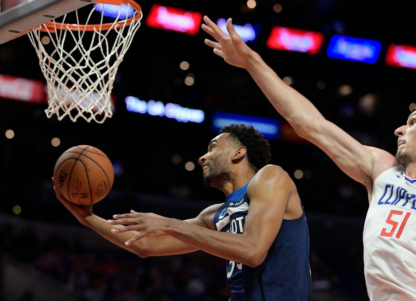 Minnesota Timberwolves forward Keita Bates-Diop, left, shoots as Los Angeles Clippers center Boban Marjanovic defends during the second half of an NBA preseason basketball game Wednesday, Oct. 3, 2018, in Los Angeles. (AP Photo/Mark J. Terrill)