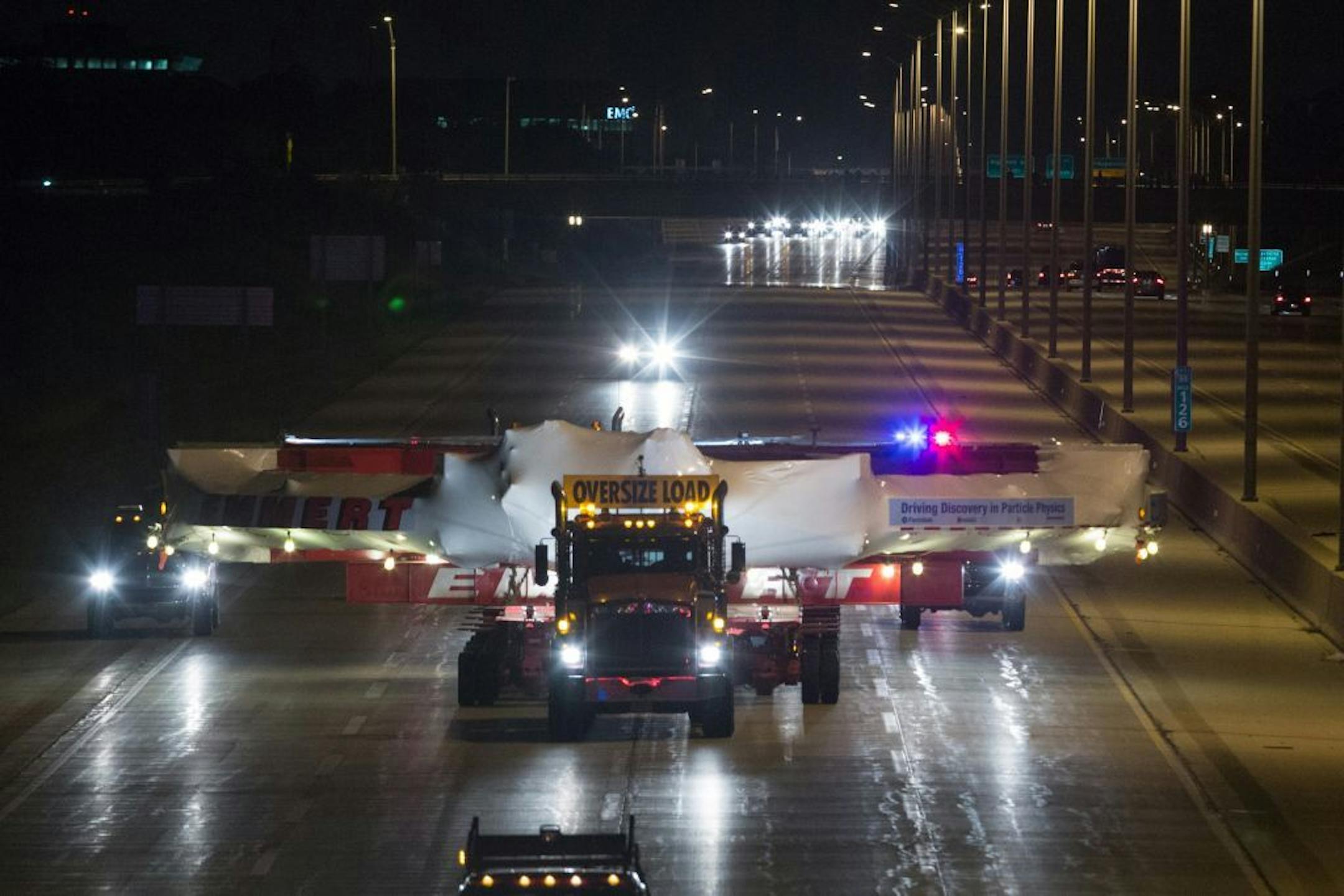 The electromagnet moves down Interstate 88 in Naperville, Ill., Friday, July 26, 2013 on its way to Fermilab.