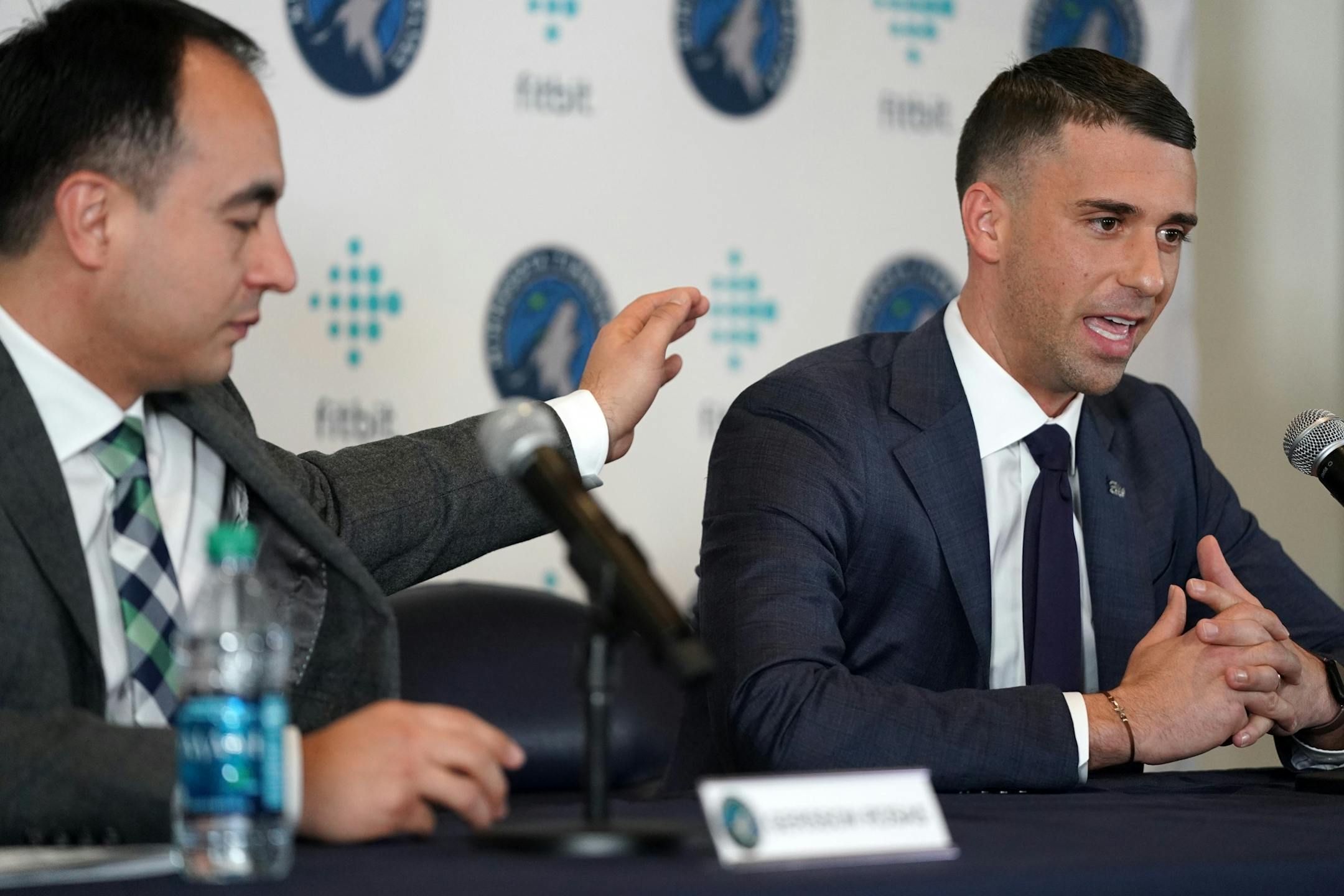 Newly named Timberwolves Head Coach Ryan Saunders got a pat on the shoulder from President of Basketball Operations Gersson Rosas as he became emotional talking about his father, former Timberwolves coach Philip Daniel "Flip" Saunders.