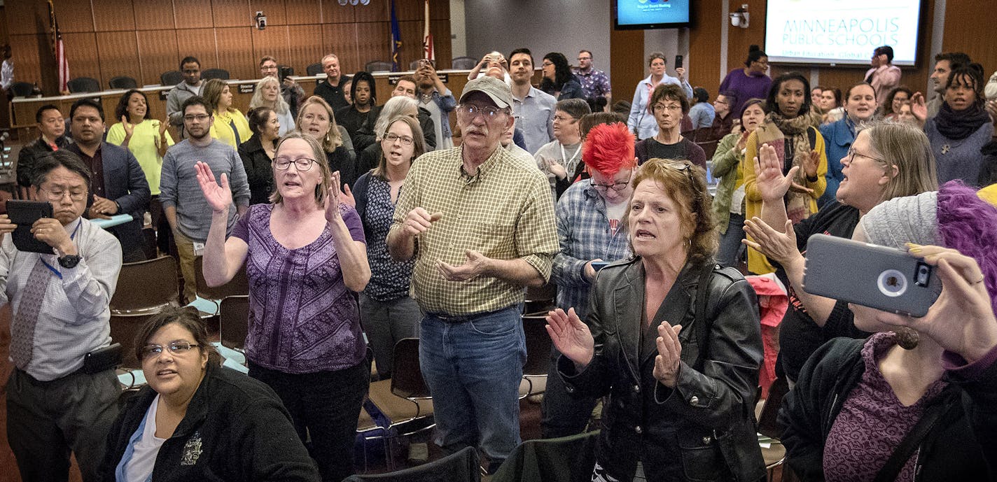 Some attendees chanted "Let them in" for a group that was initially barred from entering the meeting room because of overcapacity before the start of a Minneapolis school board meeting at the John B. Davis Education and Service Center. ] CARLOS GONZALEZ &#xef; cgonzalez@startribune.com - April 18, 2017, Minneapolis, MN, outrage over Minneapolis Public School board cuts. Protest at School Board Meeting. ORG XMIT: MIN1704181849031923