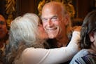 Former Minnesota Gov. Jesse Ventura got a big kiss and hug from his wife, Terry, in 2023 after the cannabis bill was signed into law.