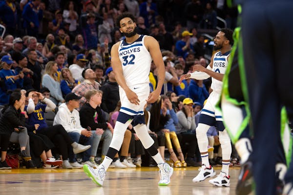 Minnesota Timberwolves forward Karl-Anthony Towns (32) celebrates after his winning 3-point basket against the Golden State Warriors during the fourth