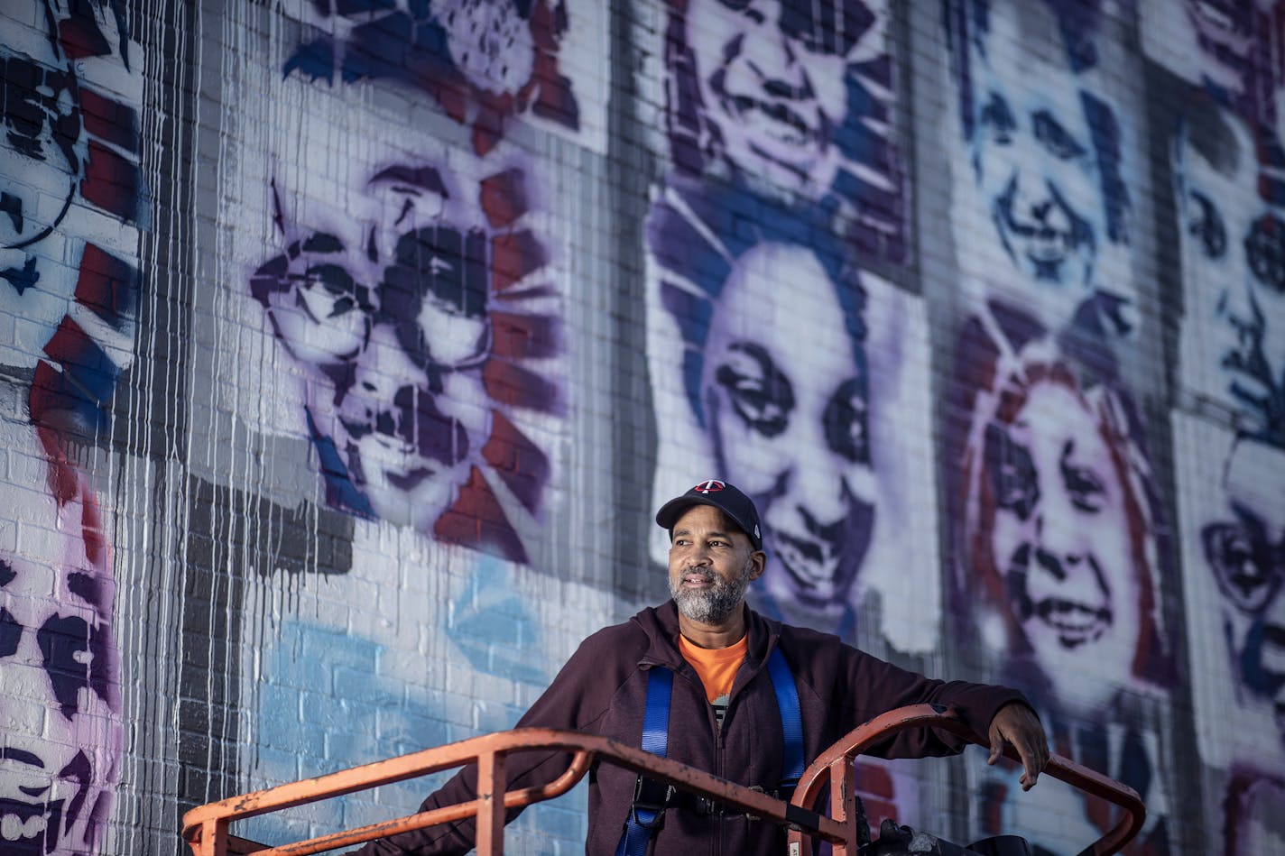 Profile of artist Peyton Scott Russell as he works on a elaborate mural at City of Lakes Community Land Trust that utilizes stencils that people created of themselves .] Jerry Holt •Jerry.Holt@startribune.com Profile of artist Peyton Scott Russell, who painted the massive George Floyd piece at 38th and Chicago. Russell is currently working on beautiful, elaborate mural at City of Lakes Community Land Trust that utilizes stencils that people created of themselves Thursday September 10,2020 in Min