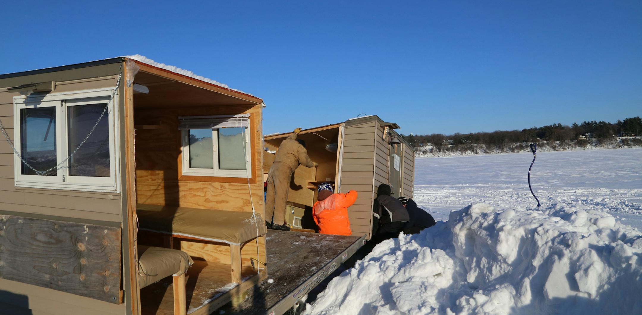 Sufficient ice has formed on most Minnesota and Wisconsin lakes to support vehicle travel. But deep, hard-packed snow is widespread, and often must be cleared by plows.
