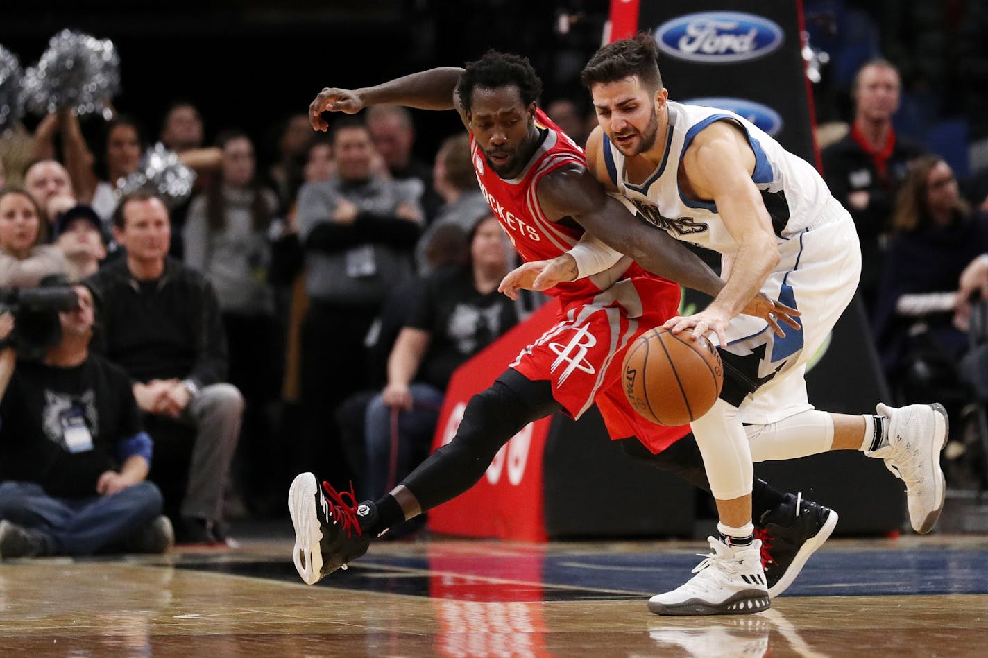 Minnesota Timberwolves guard Ricky Rubio (9) dribbles the ball around Houston Rockets guard Patrick Beverley (2) in overtime last month.