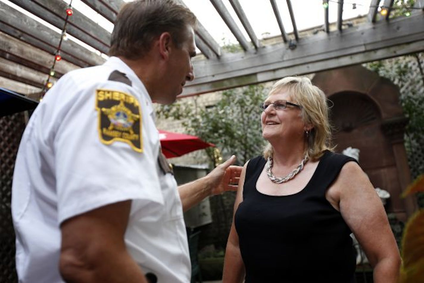 Susan Kimberly, spoke to Sheriff Bob Fletcher at her retirement part at Burger Moe's in St. Paul on Thursday. She's has been a fixture in St. Paul politics for 40 years and is retiring from her post at the St. Paul Area Chamber of Commerce.