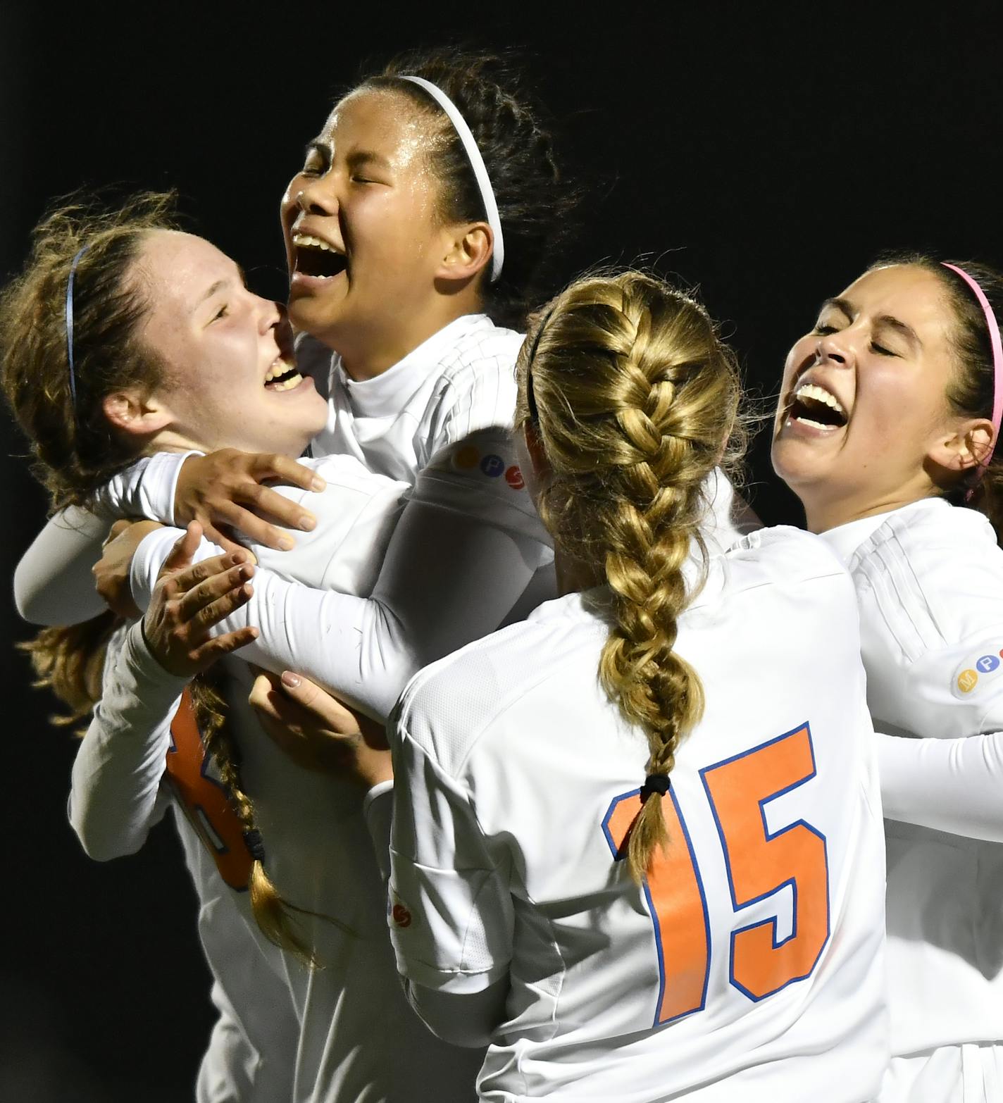 Minneapolis Washburn players celebrate with midfielder Lydia Ruppert (9), left of center, after Ruppert scored a goal against St. Michael-Albertville in the first half Wednesday. ] (AARON LAVINSKY/STAR TRIBUNE) aaron.lavinsky@startribune.com Minneapolis Washburn played St. Michael-Albertville in the 2A girls' state tournament quarterfinals on Wednesday, Oct. 26, 2016 at Farmington High School.