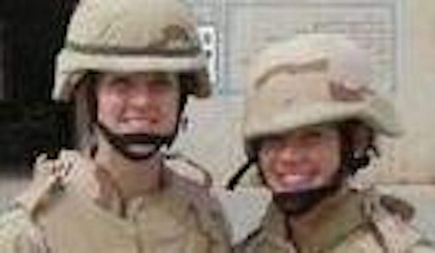 Julie Tomaska, left, and Amie Muller at the U.S. Air Base in Balad. Both report health problems.