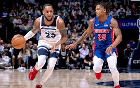 Monte Morris of the Wolves brings the ball upcourt against Detroit in a game at Target Center in March.