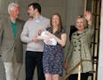Chelsea Clinton holds her newborn son Aidan as she leaves Lennon Hill Hospital with her husband Marc Mezvinsky, second left, father, former President 