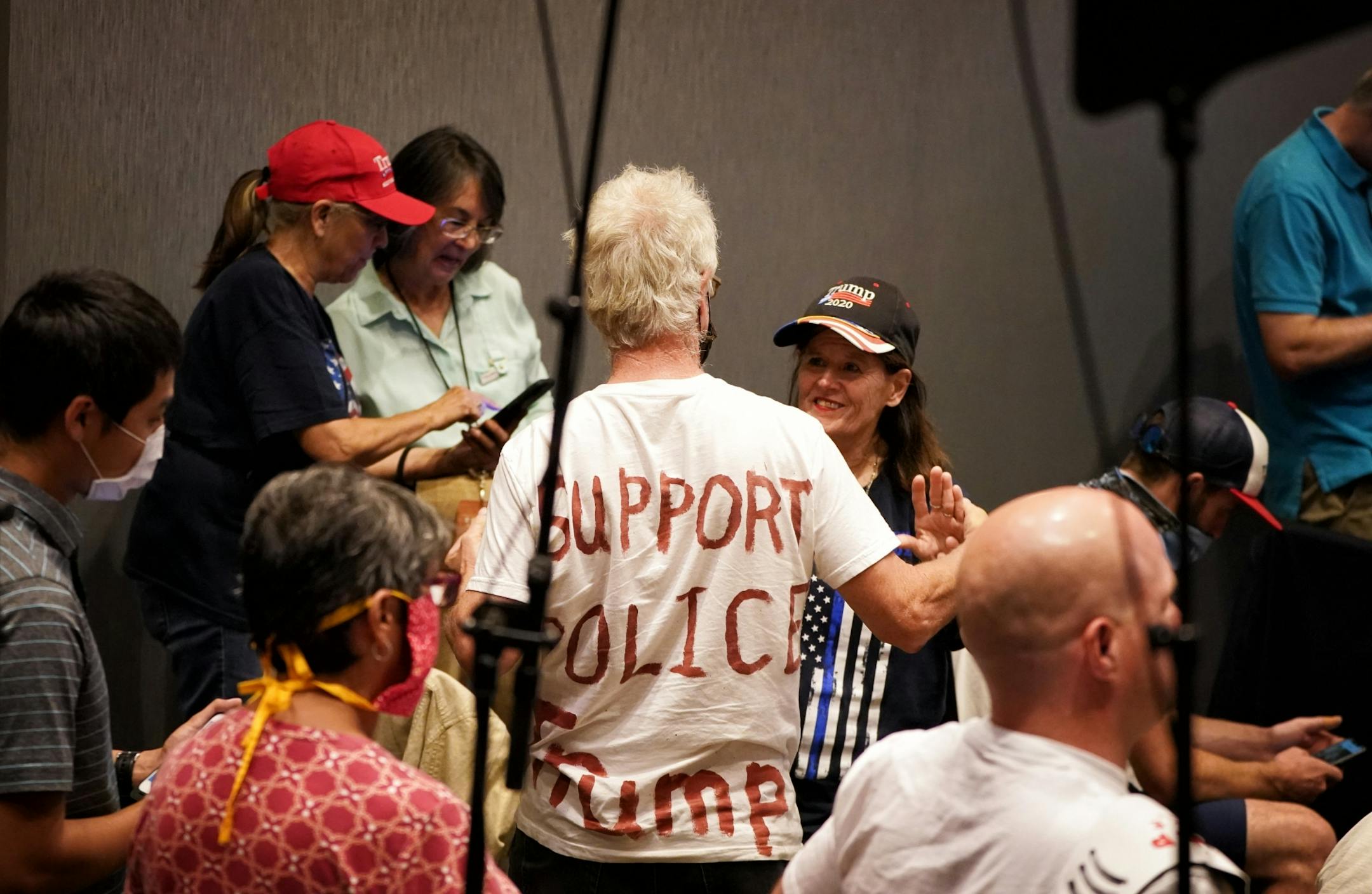 A couple danced to a country song, part of ehe entertainment before the Vice President spoke. Vice President Mike Pence and Ivanka Trump are holding a 'Cops for Trump' listening session in Minneapolis, meeting with community members whose businesses and lives have been negatively impacted by crime and rioting.
