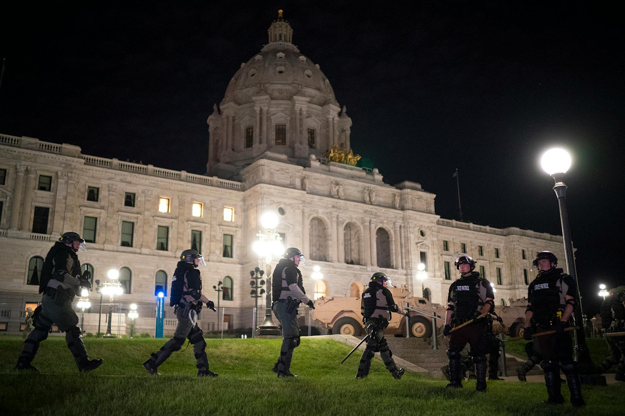 State Patrol officers formed a perimeter between the media and the officers arresting the demonstrators.