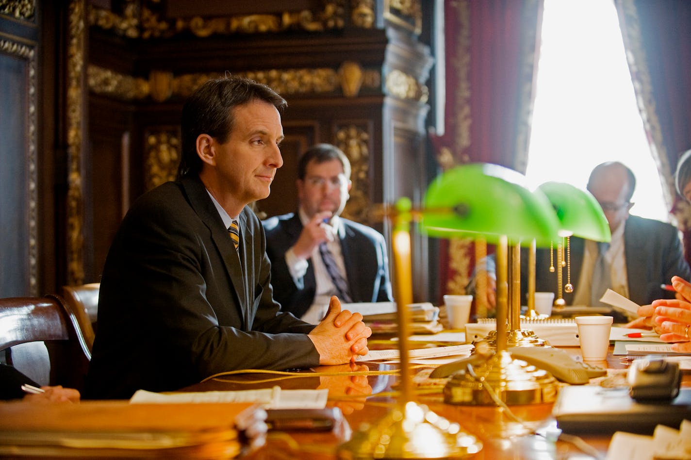 Minnesota Governor Tim Pawlenty presides over a staff budget meeting in the Governor's Reception room.