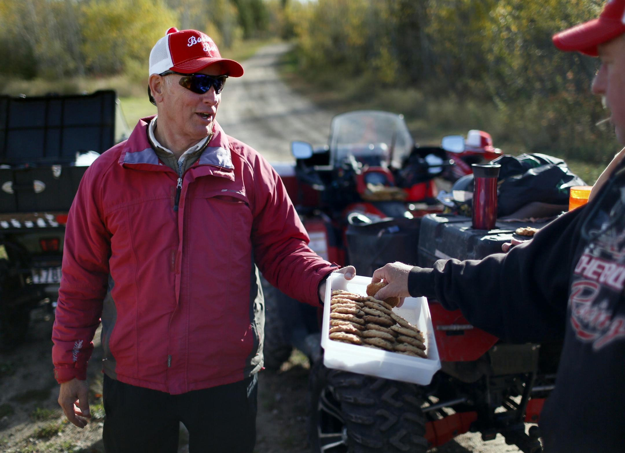 It's all about spending time outdoors, with friends. For over 30 years "Bobber" Bob Reed of Cotton has been leading a group of retired ATV enthusiasts on a trail ride every Tuesday. The group that gathers every Tuesday in the parking lot of the WIlbert Cafe in Cotton at 7 a.m., can range from a half dozen to over 30 riders. On this day, there were a dozen, the youngest, Bob Brown, 65 of Pike Lake, MN, the oldest, the "fearless leader" Bob Reed at 87. Here, during one of the frequent coffee break
