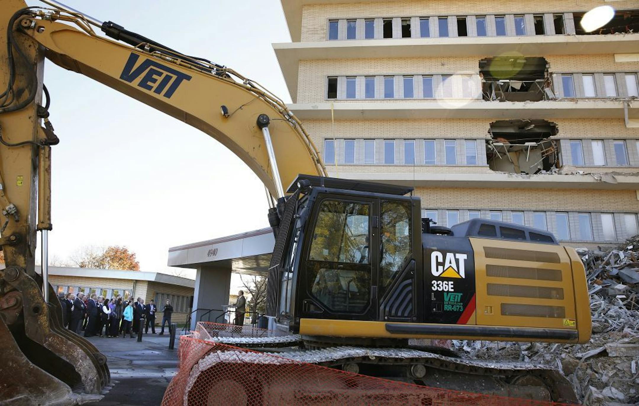 Developer Scott Tankenoff of Hillcrest Development speaks to the crowd gathered for a ceremonial sledgehammer and graffiti party at a demolition site inside Pentagon Park in Edina.