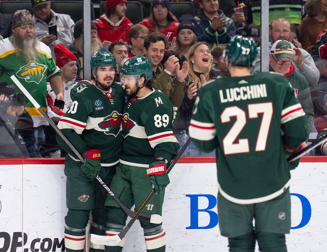Wild left wing Marcus Johansson (90) was congratulated by center Frederick Gaudreau (89) after his goal in the second period. 