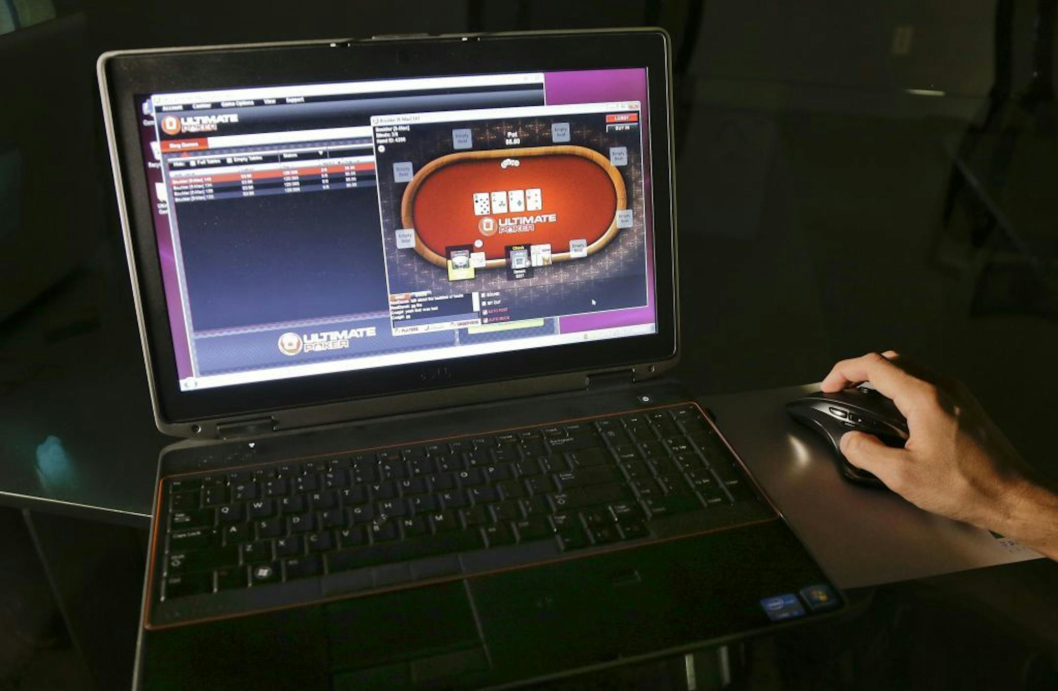 A sample poker game is played on the soon-to-be launched Ultimate Gaming website, Monday, April 29, 2013, in Las Vegas. The social gaming company is expected to launch the first legal, real-money poker site in the U.S. Tuesday morning. The Ultimate Gaming site will be available only to in players in Nevada, but likely represents the shape of things to come for gamblers across the country.