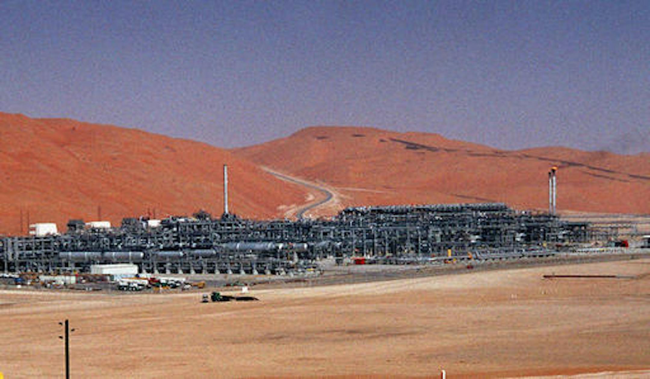 FILE - In this Monday, March 8, 2004 file photo, an industrial plant strips natural gas from freshly pumped crude oil is seen at Saudi Aramco's Shaybah oil field at Shaybah in Saudi Arabia's Rub al-Khali desert. King Salman announced the approval for the "Vision 2030" plan in a short televised announcement on Monday in which he called on Saudis to work together ensure its success. (AP Photo/Bruce Stanley, File)
