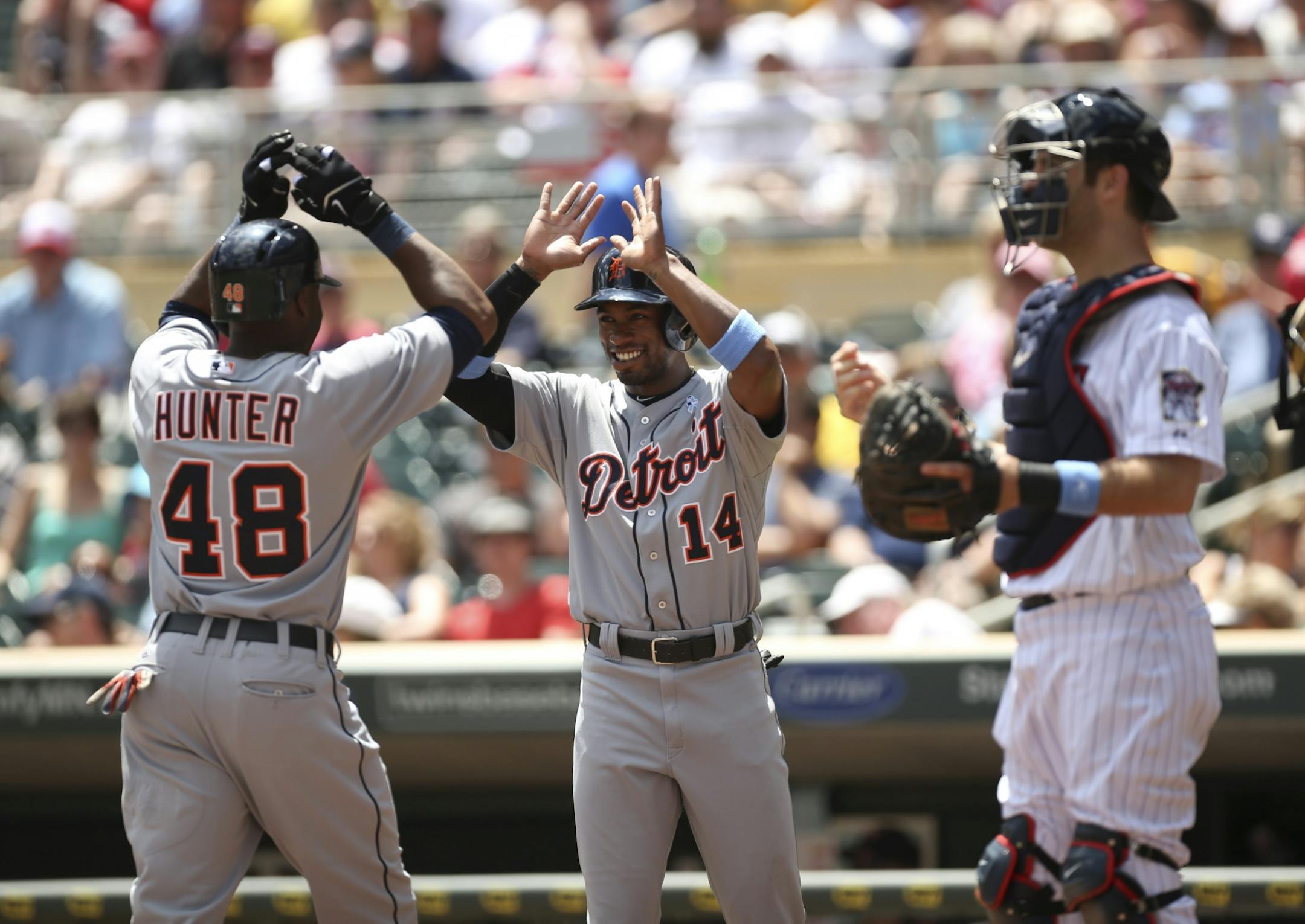 The MInnesota Twins closed out a series against the Detroit Tigers Sunday afternoon, June 16, 2013 at Target Field in Minneapolis. Detroit's Austin Jackson greeted Torii Hunter as he arrived at home after his two run homer in the first inning Sunday afternoon. Jackson scored along with Hunter to give the Tigers a 2-0 lead.