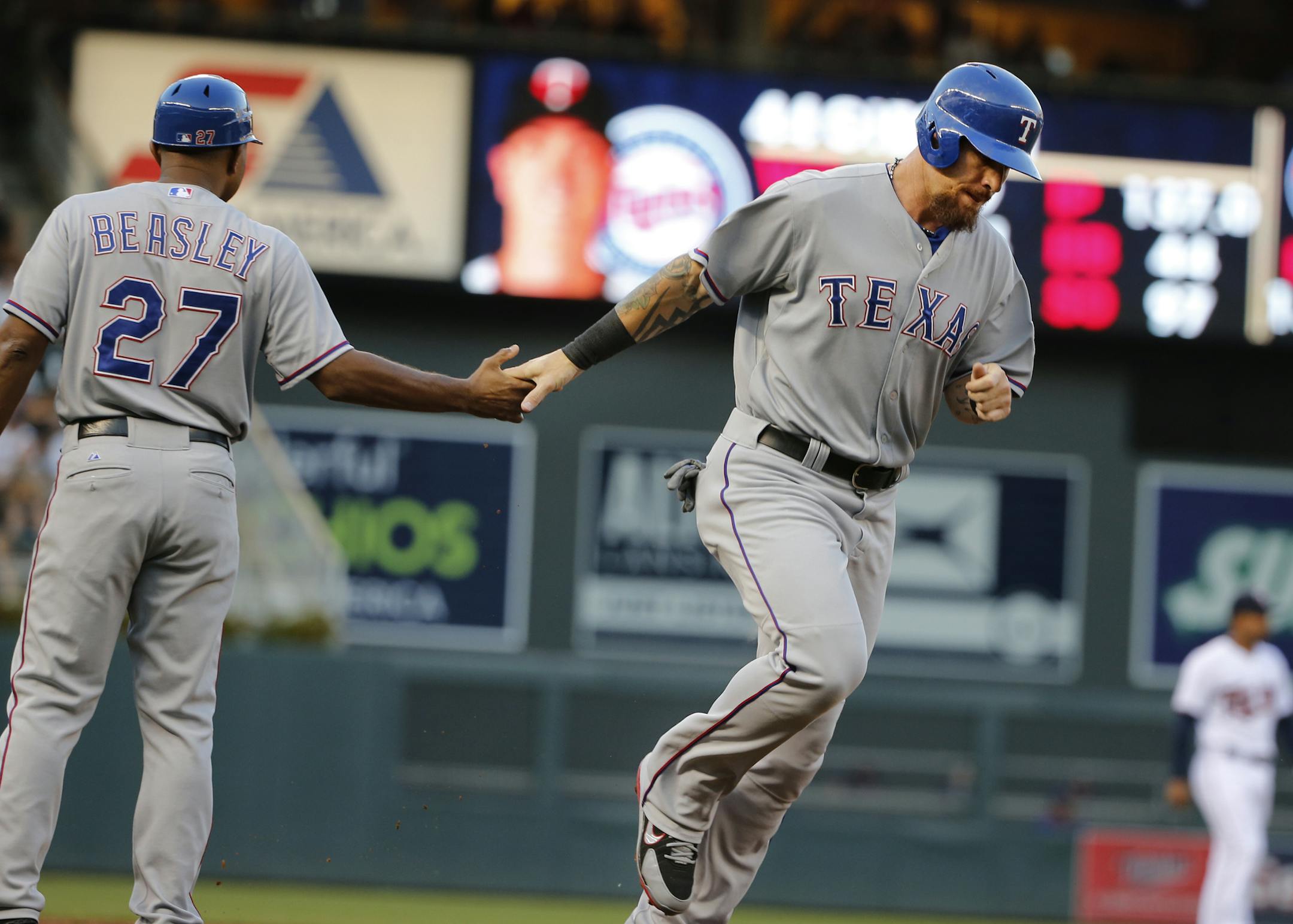 Josh Hamilton (32) rounds third base as Elvis Andrus(1) homered in the 2nd inning. ] At Target Field in a game between the Twins and the Rangers.Richard Tsong-Taatarii/rtsong-taatarii@startribune.com