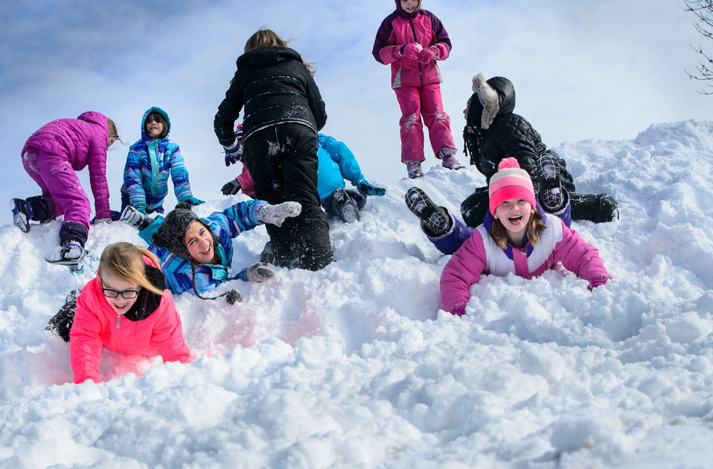 Students at Paideia Academy love it when the snow falls. For recess, they get to bundle up in their snowpants, boots and mittens and leap off of, or roll down the huge mountains of snow pushed off of their paved play area. Conditions were perfect for snow rolling Wednesday after a foot of snow fell in the south suburbs. Paideia Academy is a Public Charter School for Grades K-8 Located in Apple Valley. ] GLEN STUBBE * gstubbe@startribune.com Wednesday, February 3, 2016