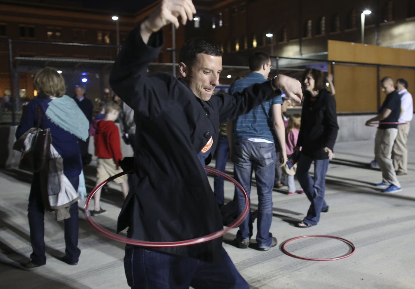 Ed Houck tried his luck at the hula hoop at the Rooftop Routine installation during the third annual Northern Spark event in St. Paul, Min., Saturday, June 8, 2013. ] (KYNDELL HARKNESS/STAR TRIBUNE) kyndell.harkness@startribune.com