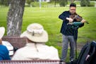 Marco Real-d'Arbelle performs a piece by Italian violinist Nicola Matteis at a pop-up concert at Rosebrook Park on Friday in Roseville.