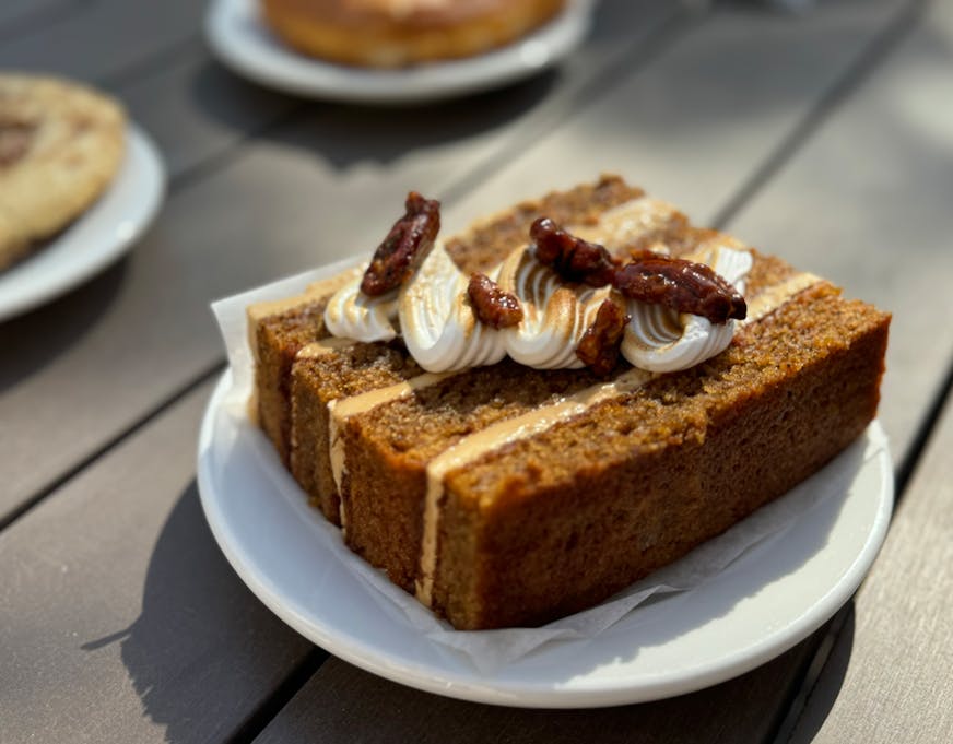 Dahlia pop up's sweet potato layer cake with coffee cream cheese buttercream frosting, toasted marshmallow fluff and candied pecans plays like a cheffy spin on the traditional carrot cake.