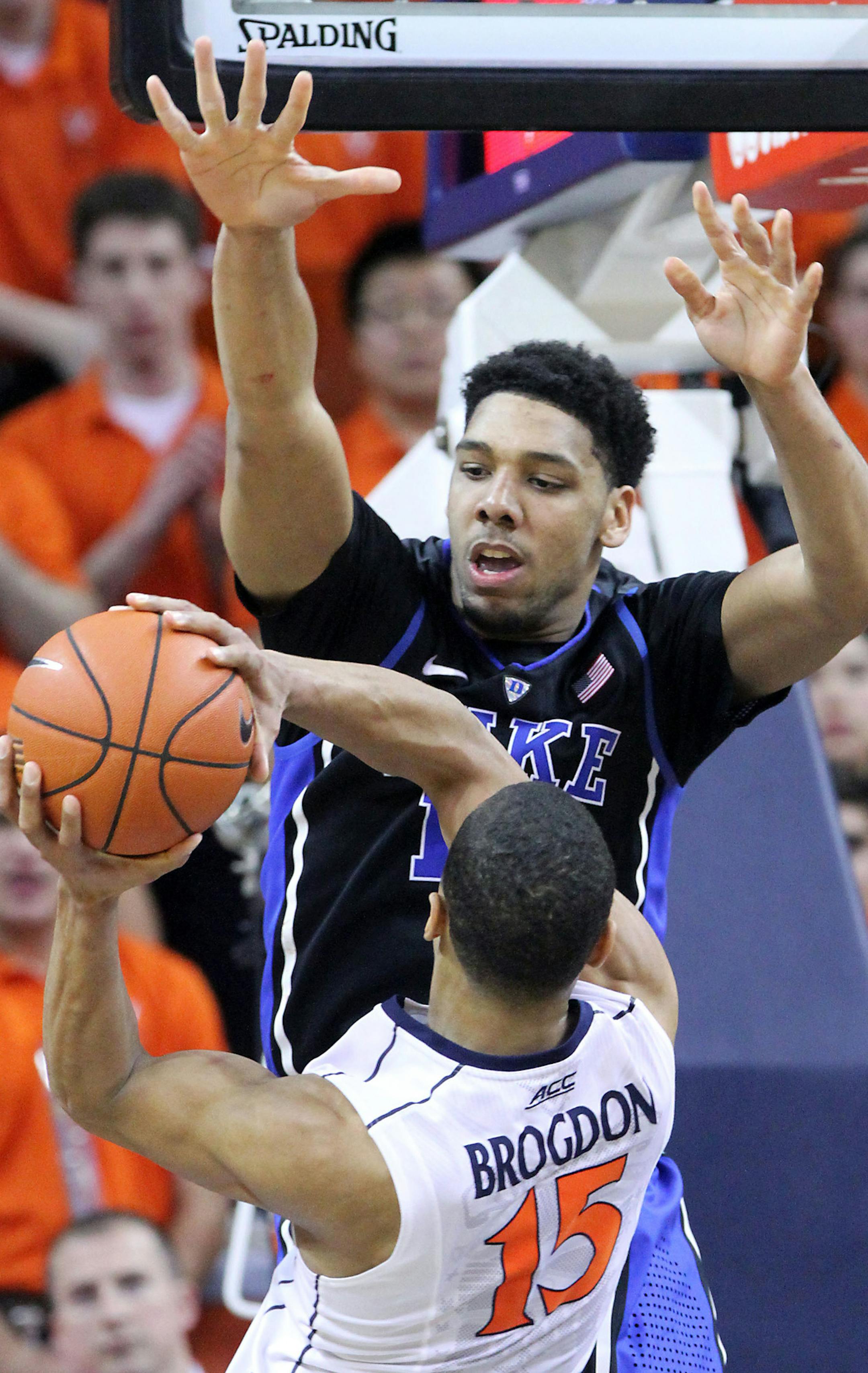Duke center Jahlil Okafor (15) defends Virginia guard Malcolm Brogdon (15) during the first half of an NCAA college basketball game in Charlottesville, Va., on Saturday, Jan. 31, 2015. Duke won 69-63. (AP Photo/Ryan M. Kelly) ORG XMIT: VARK124