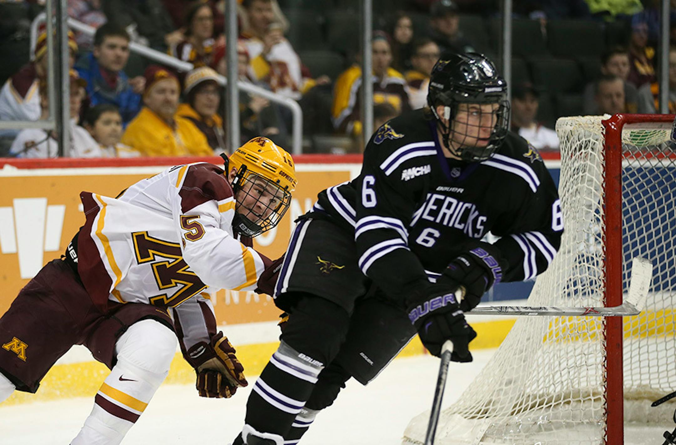 Gophers forward A.J. Michaelson (15) chased Mavericks defenseman Casey Nelson (6) in the second period Sunday afternoon.