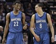 Timberwolves guards Andrew Wiggins, left, and Zach LaVine, speak during the second half of an NBA basketball game against the San Antonio Spurs, Sunda