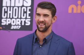 FILE - In this July 13, 2017 file photo, retired Olympic swimmer Michael Phelps arrives at the Kids' Choice Sports Awards at UCLA's Pauley Pavilion in