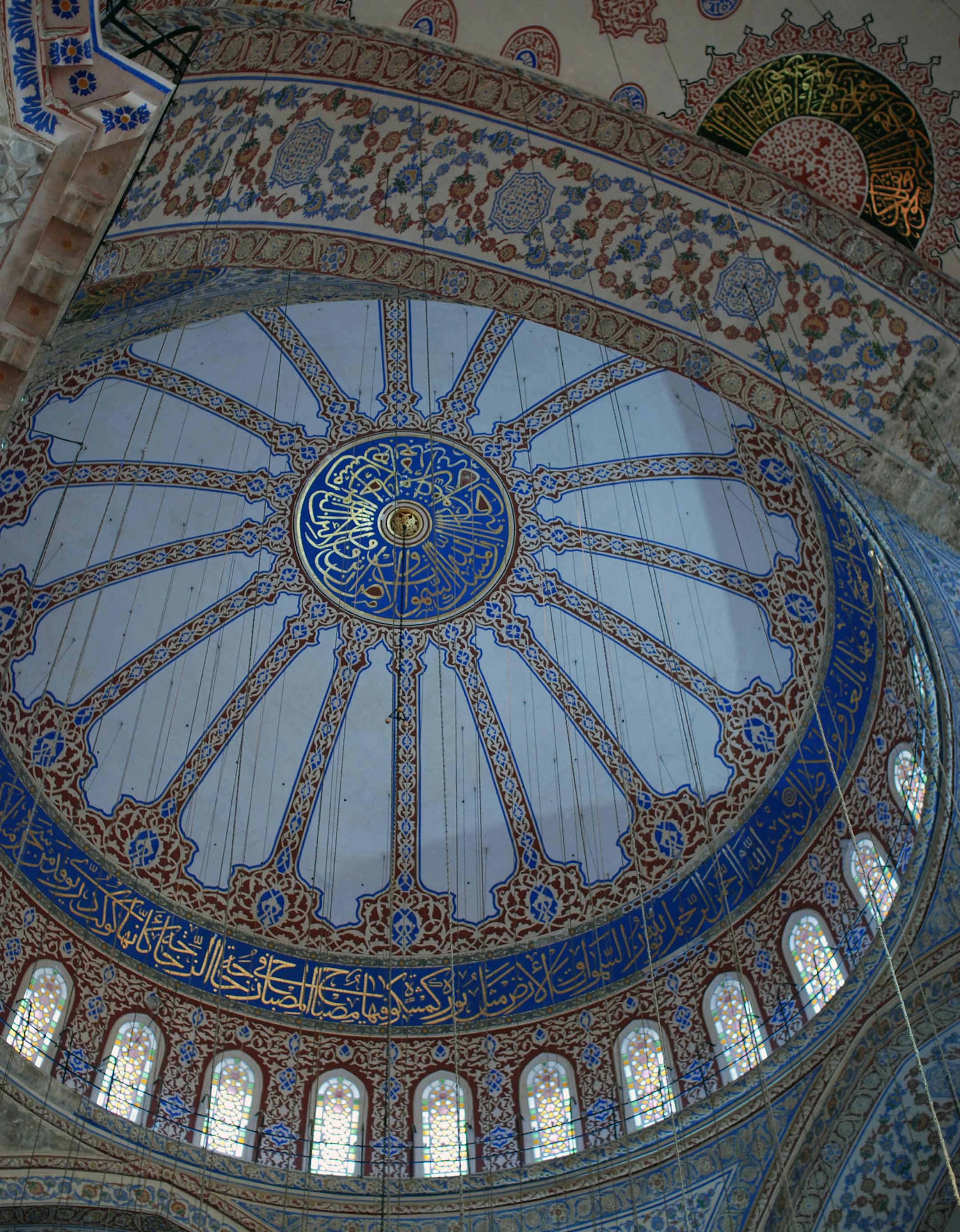 The main dome of the Blue Mosque, which is directly above the carpeted prayer area. The interior is known for its tens of thousands of handmade tiles, stained glass windows and Arabic calligraphy work. Cables run down from the ceiling to support chandeliers that hang above the prayer space. Istanbul, Turkey. Chandra Akkari - chandra.akkari@startribune.com