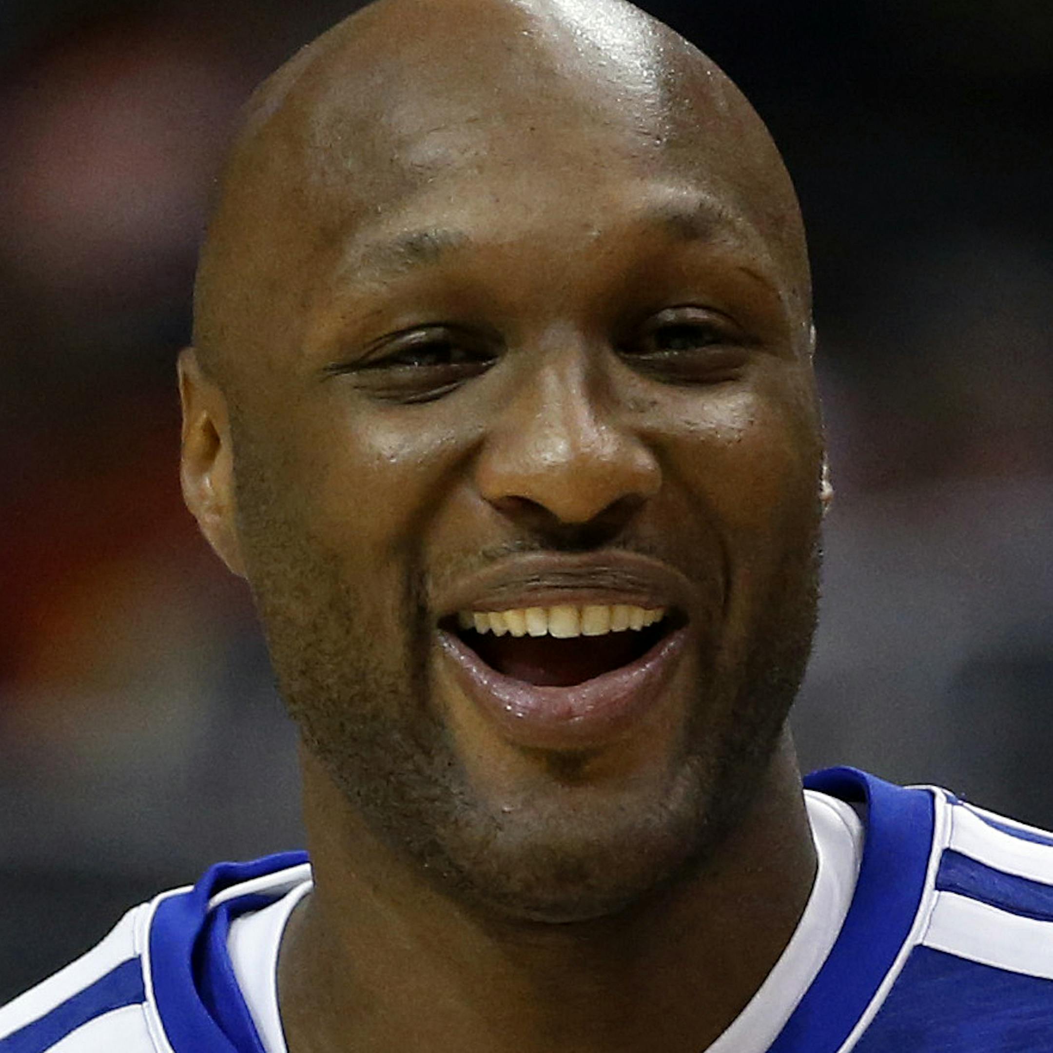 FILE - In this March 13, 2013, file photo, Los Angeles Clippers' Lamar Odom smiles during NBA basketball practice in Los Angeles. Odom was arrested for allegedly driving under the influence early Friday, Aug. 30, 2013, after a CHP officer saw his white Mercedes-Benz traveling erratically on a San Fernando Valley freeway. The CHP says Odom, 33, was arrested after failing a field sobriety test. (AP Photo/Jae C. Hong, File)