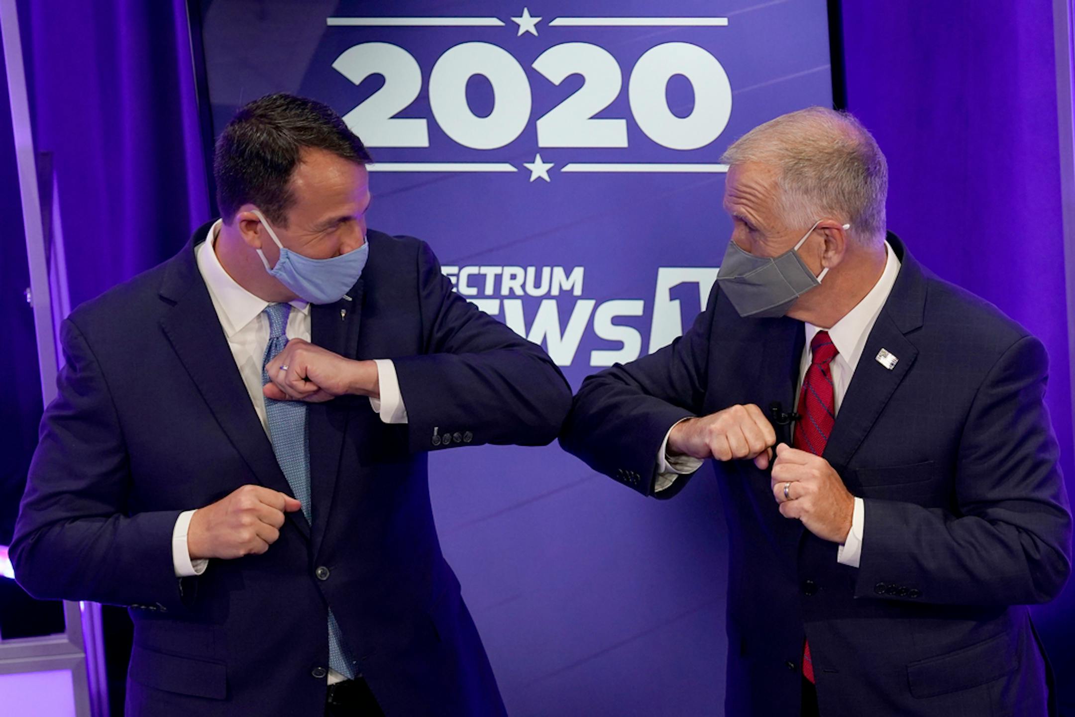 Democratic challenger Cal Cunningham, left, and U.S. Sen. Thom Tillis, R-N.C. greet each other after a televised debate Thursday, Oct. 1, 2020, in Raleigh, N.C.