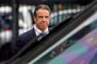 New York Gov. Andrew Cuomo prepared to board a helicopter after announcing his resignation on Tuesday. Cuomo said he will resign over a barrage of sex