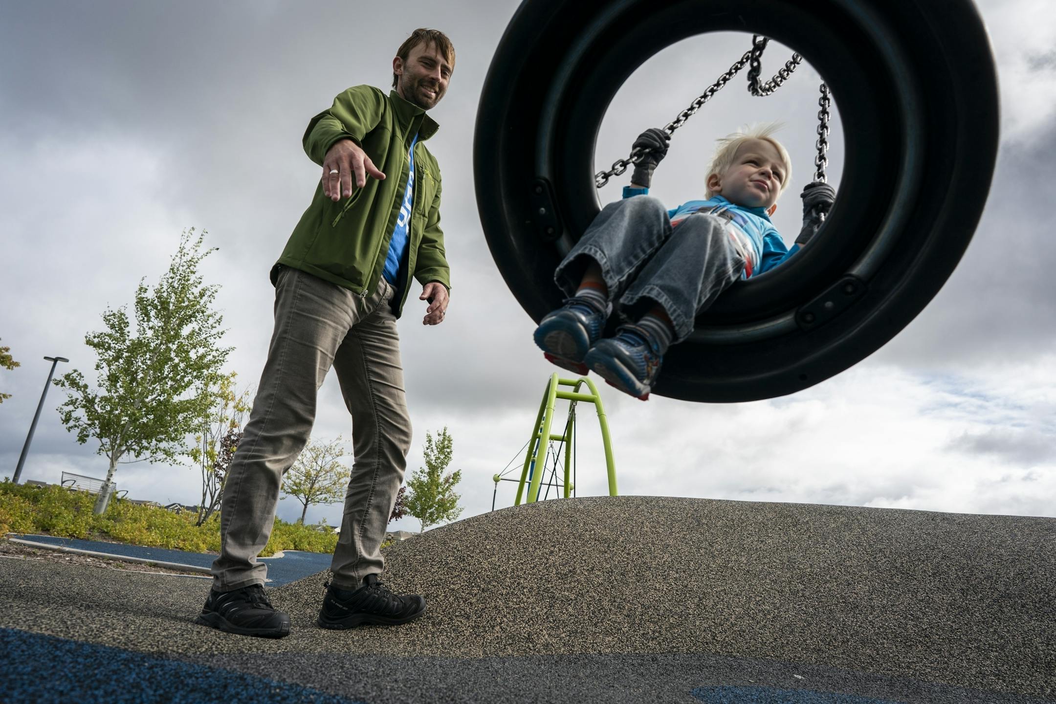 Keith Nagel plays with his son Sawyer, 3, during a Twin Cities Dads playgroup at Central Park in Maple Grove.